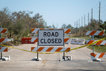 Wall Mural - Yellow protective barrier at street construction site. Warning road sign about utility work