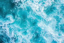 From Above Aerial View Of Turquoise Ocean Water With Splashes And Foam For Abstract Natural Background And Texture.