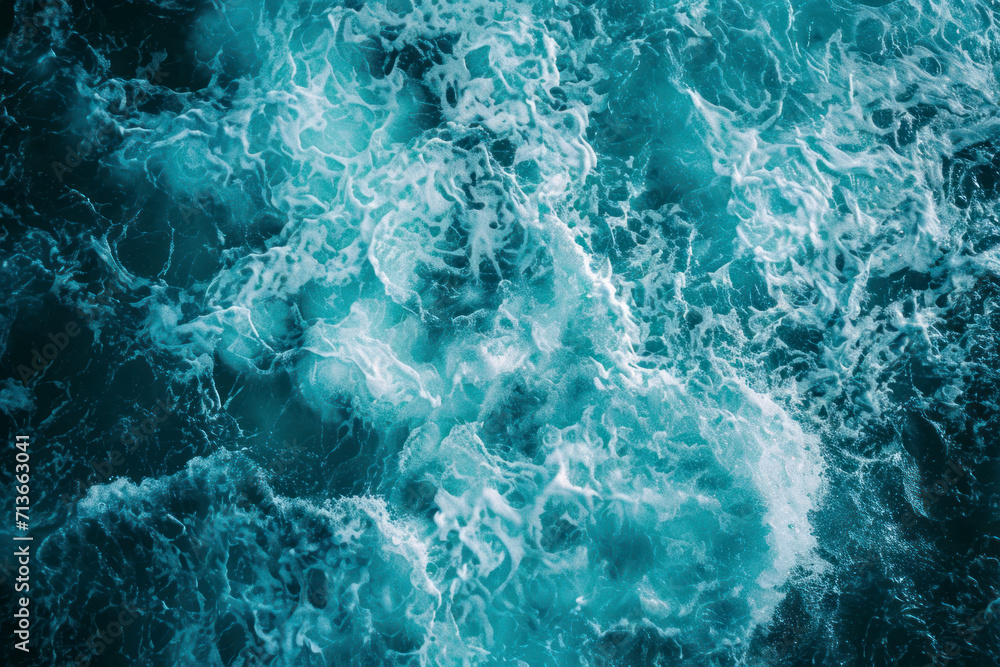From above aerial view of turquoise ocean water with splashes and foam ...