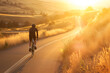 Cyclist Enjoying a Scenic Sunset Ride Along a Country Road