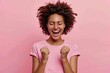 Black woman in triumph, ecstatic celebration, pink background