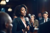 Fototapeta  - African female politician speaking during a political debate