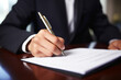 Businessman hand signing on document contract, closeup shot