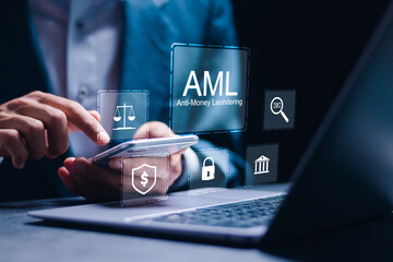 AML : Anti money laundering financial bank concept. businessman use laptop with virtual AML icon for anti money laundering regulations.