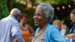 African-american elderly woman dancing in a party
