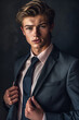 © Keitma - Portrait of a young and handsome caucasian male star in a suit