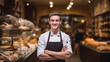 © sema_srinouljan - young baker standing in front of his pastry shop.