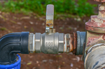 ball valve and plastic pipe on an irrigation field in the village 2