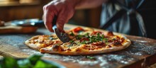 Close Up Of Male Hand Slicing Freshly Baked Pizza With Round Cutter Wheel. Creative Banner. Copyspace Image
