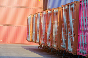 Wall Mural - container wall Multi-colored containers isolated on white Container warehouses lined up in rows Containers for automotive or sea transport