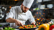 Male chef preparing vegetable vegetarian dish at a professional kitchen.