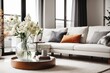 © Basileus - Scandinavian Interior home design of modern living room with flowers in a glass vase on a round table