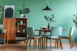 Mint-Green Scandinavian Living Room Interior with Round Dining Table and Chairs