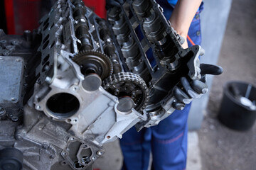 Wall Mural - Repairing a car engine in a car repair shop