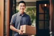 © Salsabila Ariadina - Asian man delivers an ordered package to the front door of the house during the day