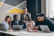 © gstockstudio - Concentrated business team planning strategy while working at the modern office together