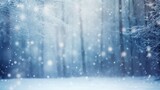 Fototapeta Paryż - Blurry image of a winter forest small snowdrifts and light snowfall - a beautiful winter-themed background wide format.