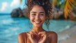 Portrait of a happy lady in bathing suit forming a heart with her hands at the seaside - Beautiful cheerful Latina woman giggling at the lens outdoors