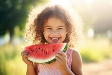 Joyful Little Girl Eats Watermelon In Nature And Smiles. Summer.