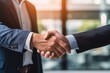 © Nuth - Businessman shaking hands a meeting with partners, with happiness outside, setting goals and planning the way to success. Collaborative teamwork.