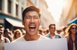 © Artem Zatsepilin - glad protester screaming with blank poster. asian activist protesting against rights violation.