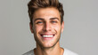 Smiling man on grey background, teeth whitening.