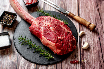 Wall Mural - raw steak
Tomahawk on wooden background