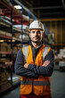 © PHB Stock - Smiling construction engineer posing with arms crossed