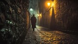 Fototapeta Uliczki - A man walks on a narrow and stony street