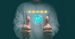 © krungchingpixs - Customer experience satisfaction concept. Hands of client thumb up positive emotion smile face icon and five star. Standardization and quality in products and services. Excellent services rating