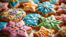  a close up of a bunch of cookies with icing on top of each and a snowflake on the top of the cookies on the bottom of the cookies.