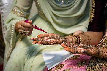 Indian bride's henna mehendi mehndi hands close up