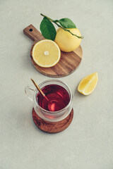 Wall Mural - Tea in a glass cup with fresh bergamot orange fruits