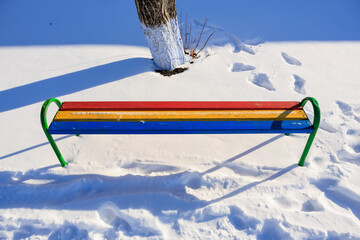 Wall Mural - Bench in tricolor, the colors of the Romanian or Moldovan flag. Blue, yellow and red colors. Background