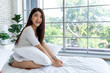 © pixs4u - Bedtime Tranquility, Serene Day in Bedroom, Young Woman Sitting Comfortably with Pillow