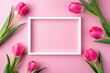 Pink tulips with white frame on pink background
