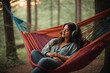 As the world around her embraced the quietude of twilight, Amelia nestled into the cozy embrace of an oversized hammock suspended between two sturdy trees. A pair of vintage, well-worn headphones a