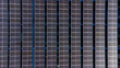 Aerial top down photo of solar panels PV modules mounted on the parking structure ro