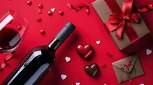 Valentine's Day Wine Bottle Chocolate Pieces Gift Box With Red Ribbon And Envelope On Red Background With White Hearts