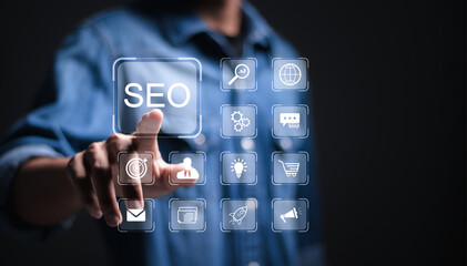 Wall Mural - businessman touch virtual seo icons to analyze seo search engine optimization for promoting ranking 