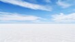 The peaceful expanse of a salt flat, the horizon stretching into the distance, unbroken and pure.