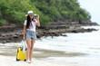 © freebird7977 - Happy traveler and tourism young women travel summer on the beach. Asian smiling people holding smartphone take photo  for relax outdoor destination leisure trip travel in holiday