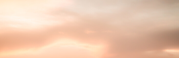 Wall Mural - pink and orange blurry sky background with sun light clouds