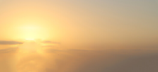 Wall Mural - blurry yellow light soft panorama sunset sky background with light yellow clouds