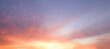 Blue Blurry soft panorama sunset sky background with red pink sun light clouds