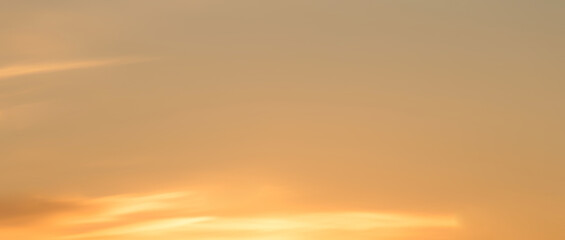 Wall Mural - pink and orange blurry sky background with sun light clouds