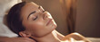 © Anoo - The woman lay on the sofa on her back with her eyes closed and enjoyed. She receives a relaxing and therapeutic suspended head massage. Spa client. Wellness medical treatments in spa