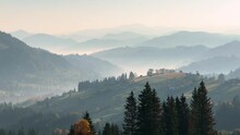 Autumn, Autumn Landscape In The Carpathians, Ukraine. Picturesque Mountain Hills, Scattered Houses Of The Mountaineers Of The Near Verkhovyna, Hedges, Haystacks, Colorful Trees In The Early Morning.