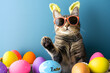 Funny cute cat celebrating with Happy Easter day on background.