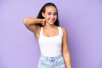 Wall Mural - Young woman isolated on purple background laughing